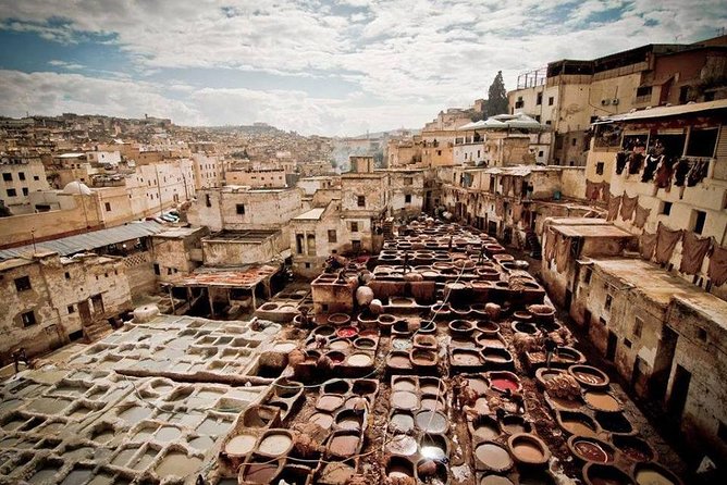 Fes Guided Sightseeing Tour with Luxury Car All Inclusive Tickets - Entering the old Medina with local guidance