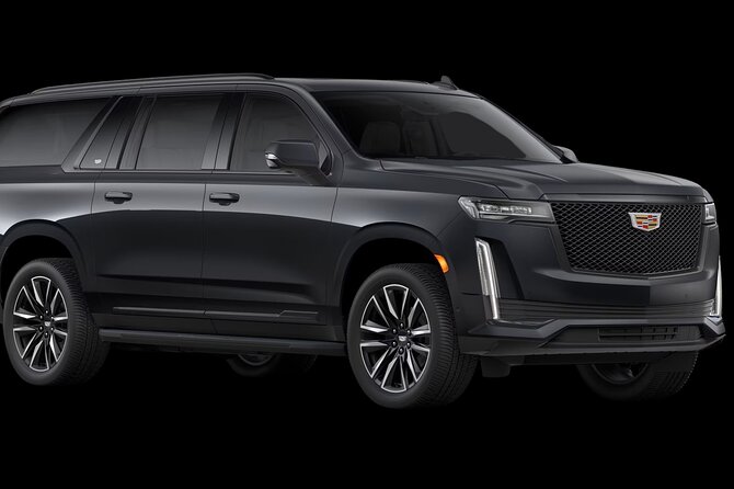 VIP Private Maui OGG Arrival Transfer in Black Cadillac Escalade - Walking out of Kahului Airport and into a private SUV